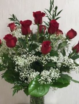 Dozen red roses in a vase